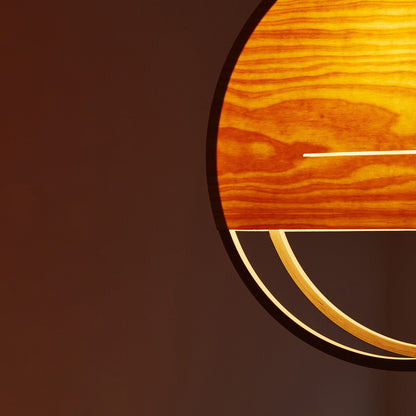 A close up of Lozi's Sunset Lamp, the translucent veneer glowing and showing the grain of the wood